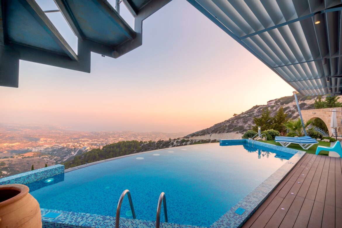 blue lounger beside swimming pool